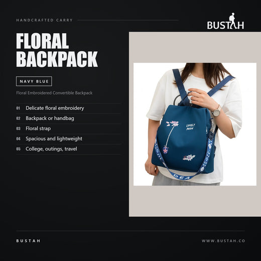 Bustah navy blue floral embroidered convertible backpack for women, worn as a backpack or handbag with floral strap